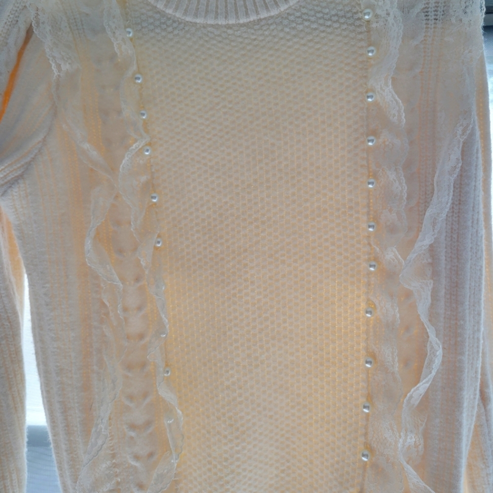 Cream, soft sweater with Lace ruffle detail and pearl detail in front